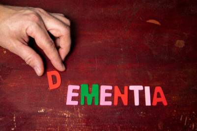 DEMENTIA. Health and aging concept. Text on a wooden background.