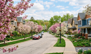 spring day with flowers in bloom looking on to a street in a neighborhood.