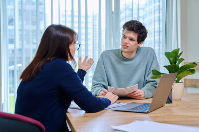 Woman attorney meeting with an 18 year old male client.