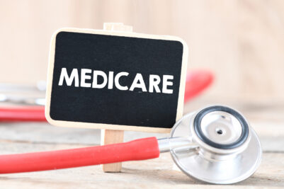 Medicare text on a chalkboard with stethoscope